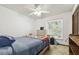 Bright bedroom featuring a ceiling fan and natural light from the window at 2204 Jennifer Ln, Valrico, FL 33594