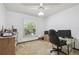 Bedroom with a ceiling fan and window, perfect for an office space at 2204 Jennifer Ln, Valrico, FL 33594
