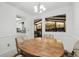 Cozy dining area with a hardwood table and seating for four, open to the living room at 2204 Jennifer Ln, Valrico, FL 33594