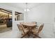 Bright dining area featuring a quaint table and chairs, with a view to the living room at 2204 Jennifer Ln, Valrico, FL 33594