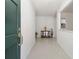 Inviting entryway with a modern green door, tiled floors, and elegant decor at 2204 Jennifer Ln, Valrico, FL 33594