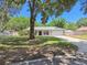 Well-maintained home with a lovely lawn, mature trees, and a two-car garage at 2204 Jennifer Ln, Valrico, FL 33594