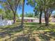 Beautiful home with lush front yard featuring mature trees and well-maintained landscaping at 2204 Jennifer Ln, Valrico, FL 33594