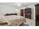 Bright main bedroom with neutral colors, featuring an en-suite bathroom and ample closet space at 2204 Jennifer Ln, Valrico, FL 33594