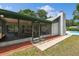 Charming screened patio connected to home, providing a cozy space for relaxation and leisure activities at 2204 Jennifer Ln, Valrico, FL 33594