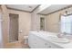 Well-maintained bathroom featuring a double vanity, toilet, and a glass-enclosed walk-in shower at 2314 50Th E Dr, Bradenton, FL 34203