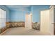Bedroom with carpet floors and custom wallpaper at 2314 50Th E Dr, Bradenton, FL 34203