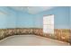 Charming bedroom featuring whimsical sky-painted walls and a bright window at 2314 50Th E Dr, Bradenton, FL 34203