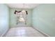 This dining area offers tile flooring, light green paint, and a large window providing natural light at 2314 50Th E Dr, Bradenton, FL 34203