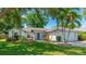 Charming front exterior of the home with a well-manicured lawn and inviting curb appeal at 2314 50Th E Dr, Bradenton, FL 34203