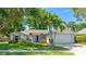 Charming single-story home with lush landscaping and a well-manicured front yard at 2314 50Th E Dr, Bradenton, FL 34203