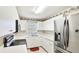 Efficient kitchen featuring white cabinets, stainless steel appliances, and ample counter space at 2314 50Th E Dr, Bradenton, FL 34203