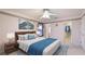 Relaxing main bedroom with a plush bed, serene decor, and an en-suite closet for ample storage at 2314 50Th E Dr, Bradenton, FL 34203