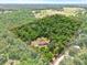 Expansive property surrounded by dense trees, offering privacy and seclusion at 24498 Casey Rd, Brooksville, FL 34601