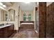 The bathroom has a soaker tub and glass-enclosed shower at 24498 Casey Rd, Brooksville, FL 34601