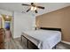 Bedroom with neutral wall, wood-look flooring, and access to an adjacent room at 24498 Casey Rd, Brooksville, FL 34601
