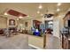 Modern kitchen featuring an island, stainless steel appliances, and an adjacent dining area and living room at 24498 Casey Rd, Brooksville, FL 34601