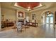 Cozy living room with a fireplace, comfortable seating, and a bright, open layout and tile flooring at 24498 Casey Rd, Brooksville, FL 34601