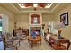 Elegant living room with fireplace, comfortable seating, and seamless access to the outdoor pool area at 24498 Casey Rd, Brooksville, FL 34601