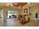 Spacious living room with a fireplace, comfortable seating, and a view of the outdoor pool area at 24498 Casey Rd, Brooksville, FL 34601