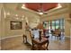 Spacious living room with ceiling fan, recessed lighting, and sliding doors to a covered patio at 24498 Casey Rd, Brooksville, FL 34601