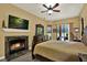 The main bedroom has a fireplace, TV, and backyard views at 24498 Casey Rd, Brooksville, FL 34601