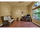 Cozy office space with wood floors, a large window, and an area for reading at 24498 Casey Rd, Brooksville, FL 34601