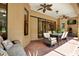 Outdoor patio with brick floors, comfortable seating, and a ceiling fan at 24498 Casey Rd, Brooksville, FL 34601