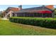 Fenced backyard with a screened-in pool and view of the home's exterior at 30314 Fairway Dr, Wesley Chapel, FL 33543