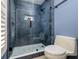 Tiled walk-in shower with glass door and sleek fixtures in a modern bathroom at 30314 Fairway Dr, Wesley Chapel, FL 33543