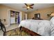 Bedroom featuring a closet with shelving and a view into an adjacent room at 30314 Fairway Dr, Wesley Chapel, FL 33543