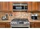 Gourmet kitchen with stainless steel appliances and granite countertops at 30314 Fairway Dr, Wesley Chapel, FL 33543