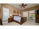 Inviting main bedroom with access to the pool area and ample natural light at 30314 Fairway Dr, Wesley Chapel, FL 33543