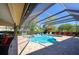 Screened in pool and spa with brick paved deck and outdoor furniture at 30314 Fairway Dr, Wesley Chapel, FL 33543