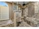 Luxurious shower with mosaic tile details and a glass enclosure at 30314 Fairway Dr, Wesley Chapel, FL 33543
