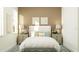 Cozy bedroom with soft lighting, stylish decor, and a comfortable bed, perfect for relaxation at 31556 Cardinal Yard Dr, San Antonio, FL 33576