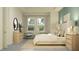 Stylishly furnished bedroom featuring neutral decor, large windows, and a comfortable seating area at 31556 Cardinal Yard Dr, San Antonio, FL 33576
