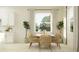 Bright dining space features a white table, woven chairs, and large windows for a modern and inviting atmosphere at 31556 Cardinal Yard Dr, San Antonio, FL 33576