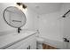 Updated bathroom with modern vanity, stylish fixtures, and shower-tub combination at 3847 Lighthouse Way # 3847, New Port Richey, FL 34652
