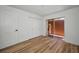 Clean bedroom with new floors, closet and glass doors providing access to outdoors at 3847 Lighthouse Way # 3847, New Port Richey, FL 34652