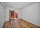 Bright bedroom featuring modern flooring, closet, and a sliding glass door for natural light at 3847 Lighthouse Way # 3847, New Port Richey, FL 34652