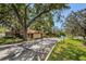 Welcoming entrance to a Beacon Lakes community with mature trees at 3847 Lighthouse Way # 3847, New Port Richey, FL 34652