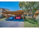 Inviting home exterior with covered parking, vibrant landscaping, and a welcoming atmosphere at 3847 Lighthouse Way # 3847, New Port Richey, FL 34652
