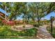 Beautifully landscaped fountain area with benches, perfect for relaxing outdoors at 3847 Lighthouse Way # 3847, New Port Richey, FL 34652