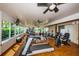 Bright fitness center with modern equipment, ceiling fans, and water view at 3847 Lighthouse Way # 3847, New Port Richey, FL 34652