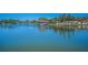 Scenic lake view featuring a gazebo and beautiful landscaping in a waterfront community at 3847 Lighthouse Way # 3847, New Port Richey, FL 34652