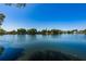 Scenic view of the lake showcasing its serene beauty and surrounding neighborhood at 3847 Lighthouse Way # 3847, New Port Richey, FL 34652