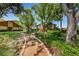 Scenic walkway lined with lush landscaping leading to the house at 3847 Lighthouse Way # 3847, New Port Richey, FL 34652