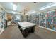 Library room featuring floor to ceiling book shelves and a game table at 3847 Lighthouse Way # 3847, New Port Richey, FL 34652