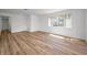 Spacious living room with wood floors and ample natural light at 3847 Lighthouse Way # 3847, New Port Richey, FL 34652
